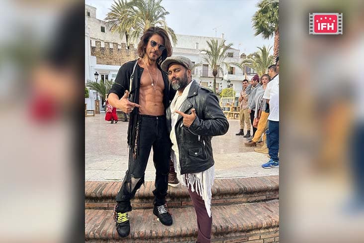 Shah Rukh Khan Poses With The Choreographer Bosco Martis. Looks Every Bit Of A Dapper As His Fans Admire His Abs And The New Look For The Film Pathaan.