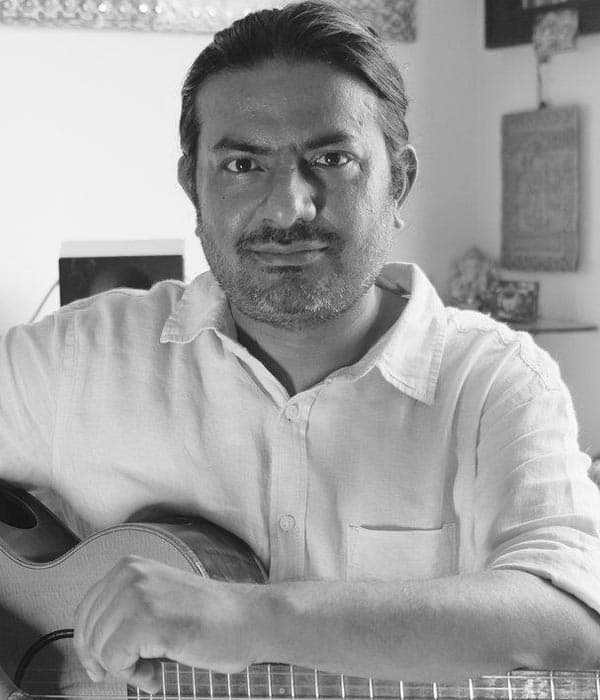 Neil Mukherjee — Music Director
