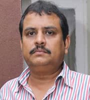 Ezhil — Director